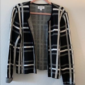 Checkered black and white open front cardigan.